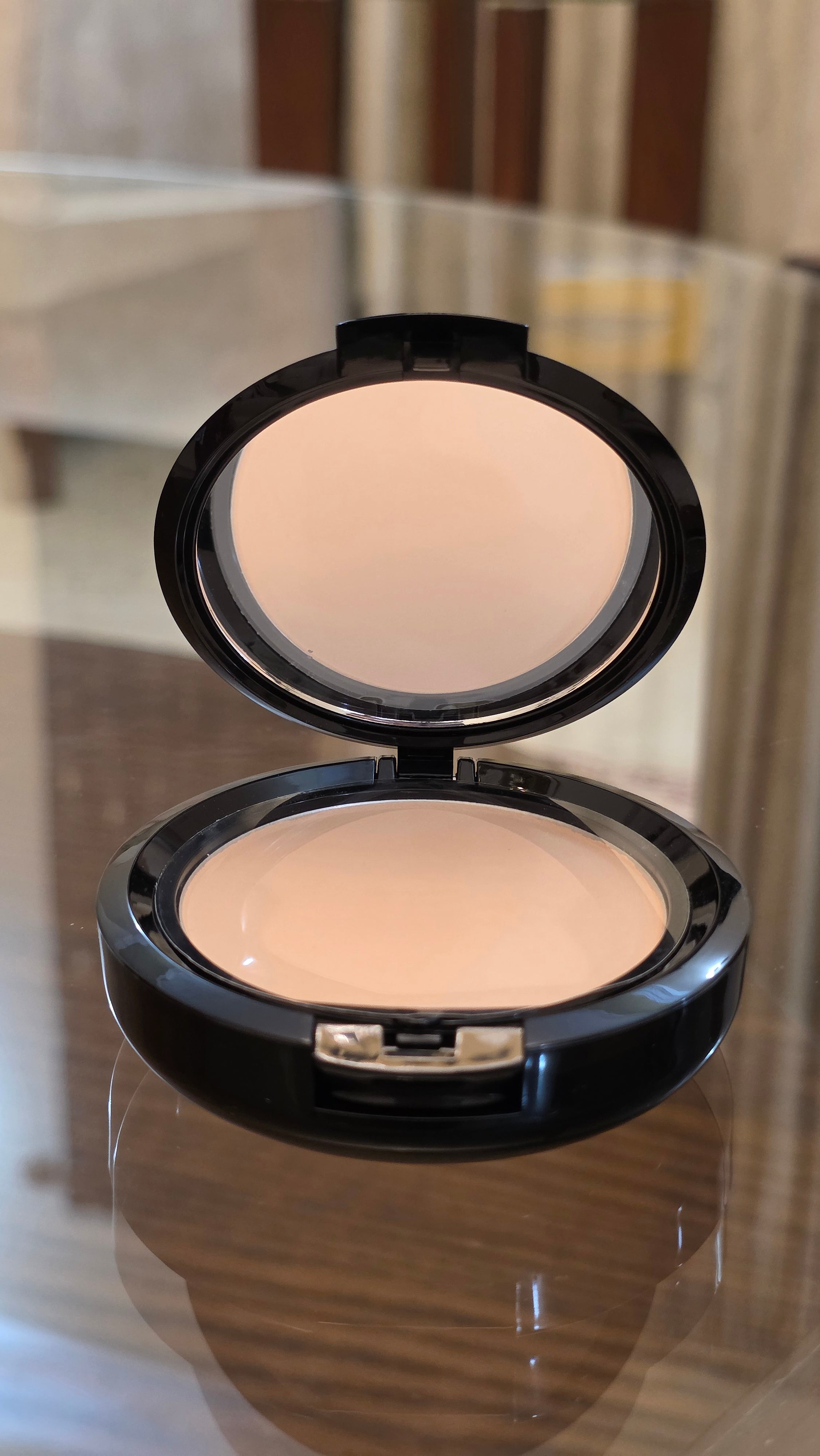 Shade of NYX Professional Makeup Stay Matte But Not Flat Powder Foundation in Shade 03 Natural.
